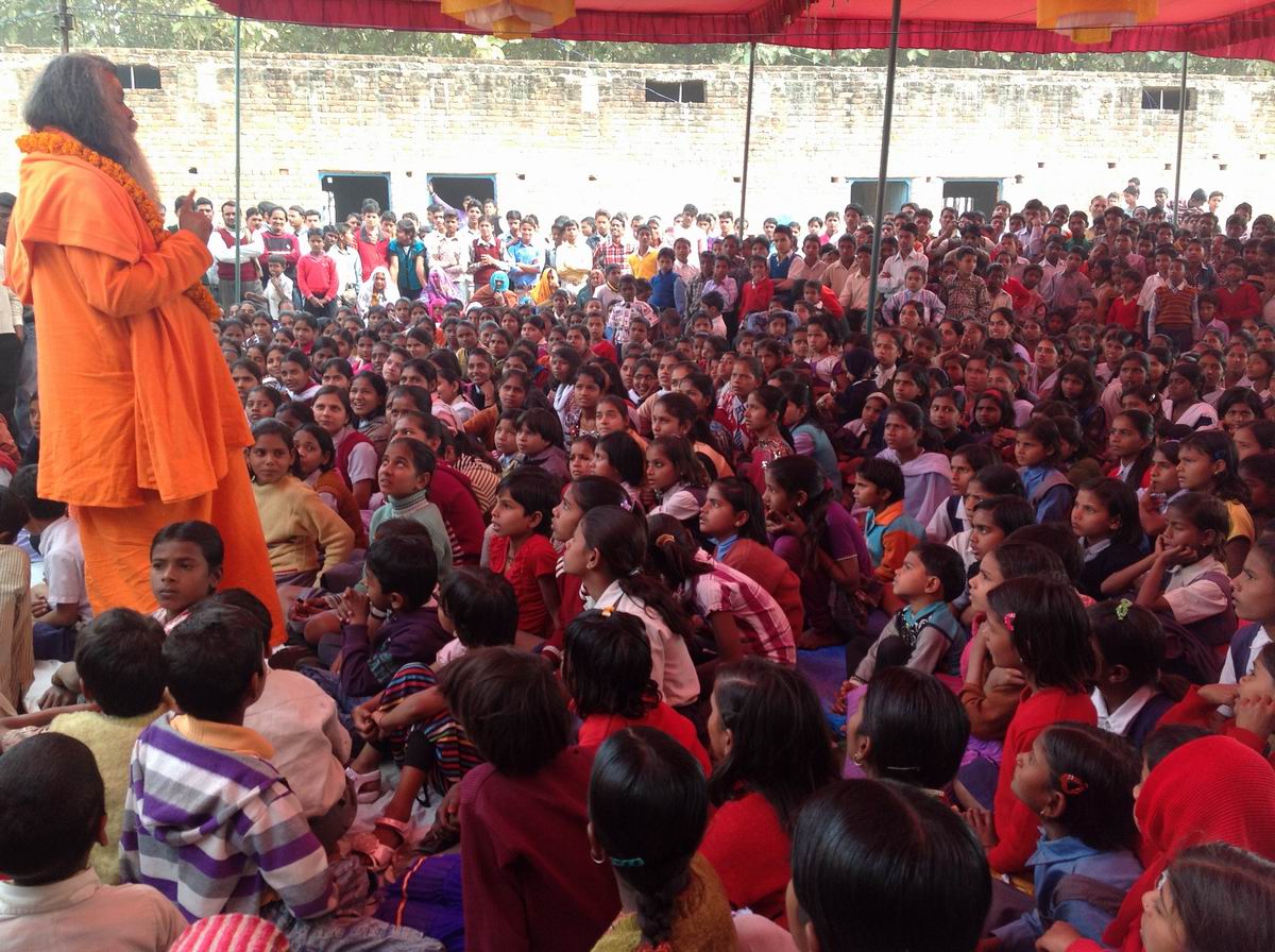 3 Swamiji teaching the school children Mantras for peace and their successful education