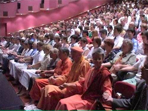 Visitors holding hands and praying for peace in the world