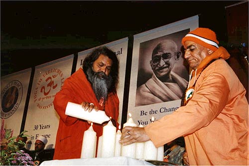 Mahamandaleshwars Paramhans Swami Maheshwarananda and Swami Niranjanananda are liting candles for peace