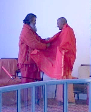 Swamiji presents a shawl to Swami Sahajanandji