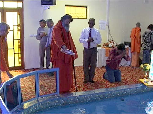 Swamiji pours Ganga water